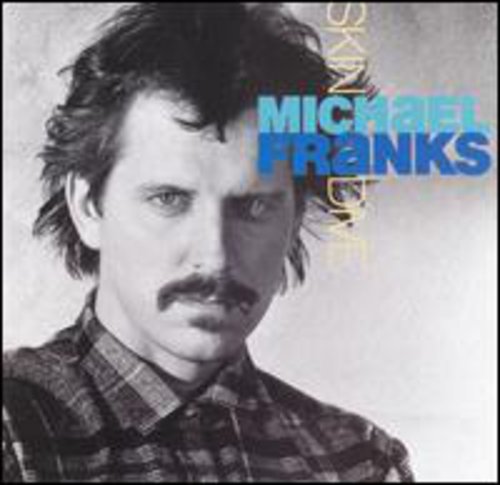 the album cover for Michael Franks - Skin Dive