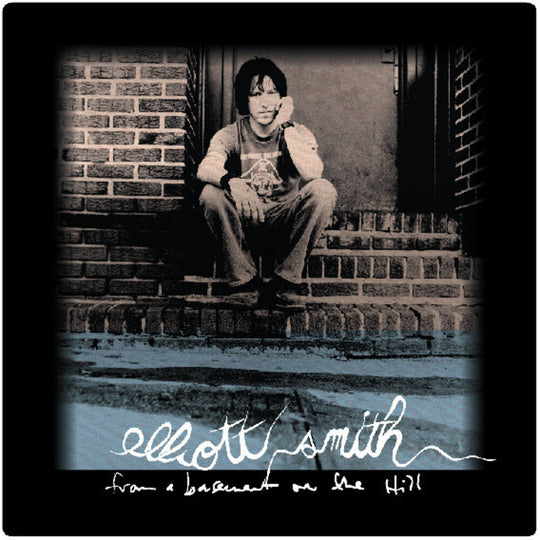 the album cover for Elliott Smith - From A Basement On The Hill (Remaster)