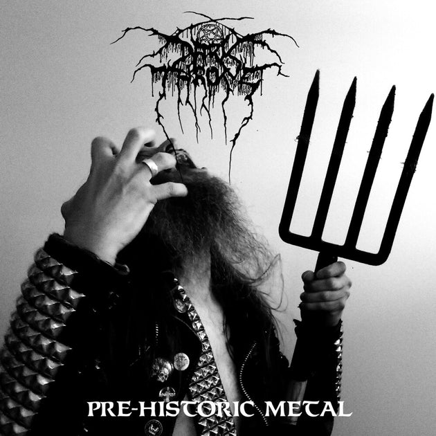 the album cover for Darkthrone - Pre-Historic Metal [Transparent Orange]