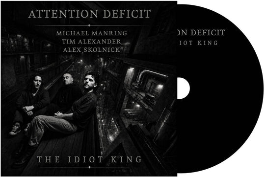the album cover for Attention Deficit - The Idiot King